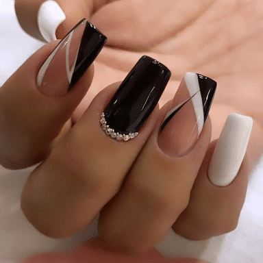 estilo de uñas negras con blanco
